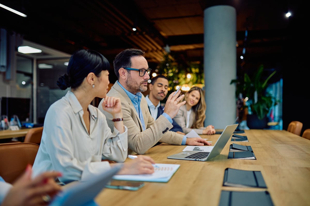 Business professionals meeting to review benefits coverage options